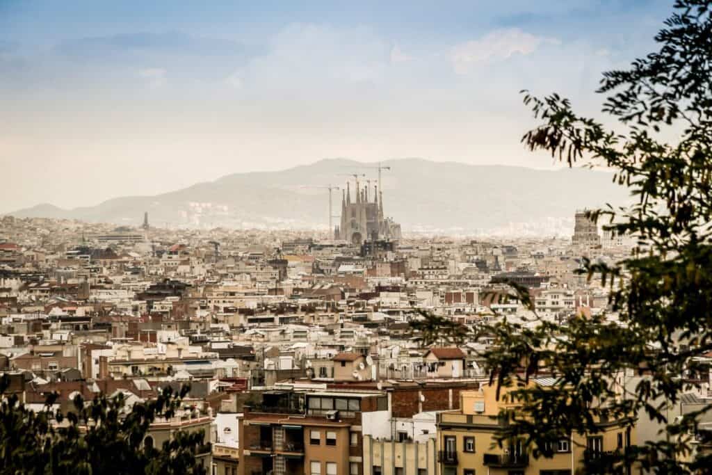 City of Barcelona overlook with Sagrada Familia and a mountain in the distance