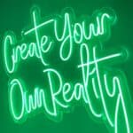 Neon green sign saying 'Create Your Own Reality' on a dark background, with a soft glow around the cursive lettering.